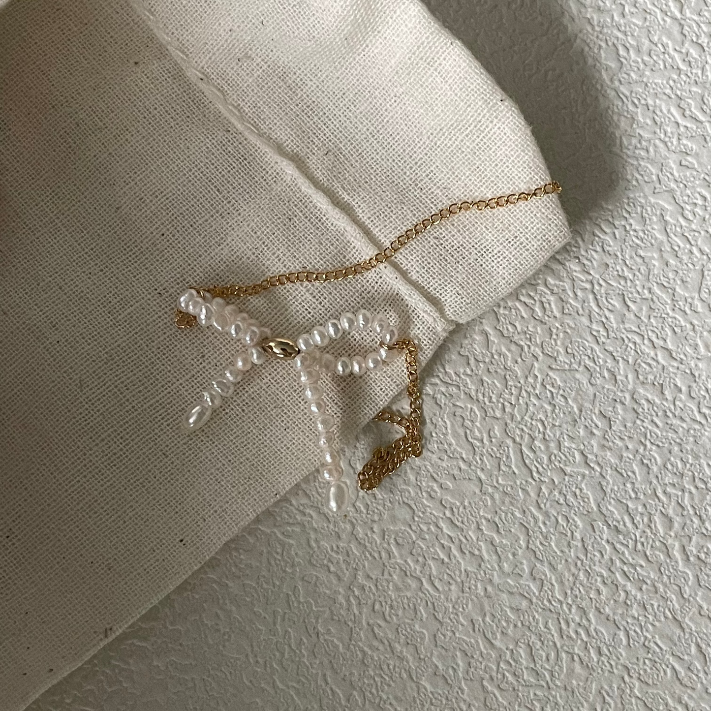 3-4mm Rice-Shaped Baroque Freshwater Pearl Bow Necklace